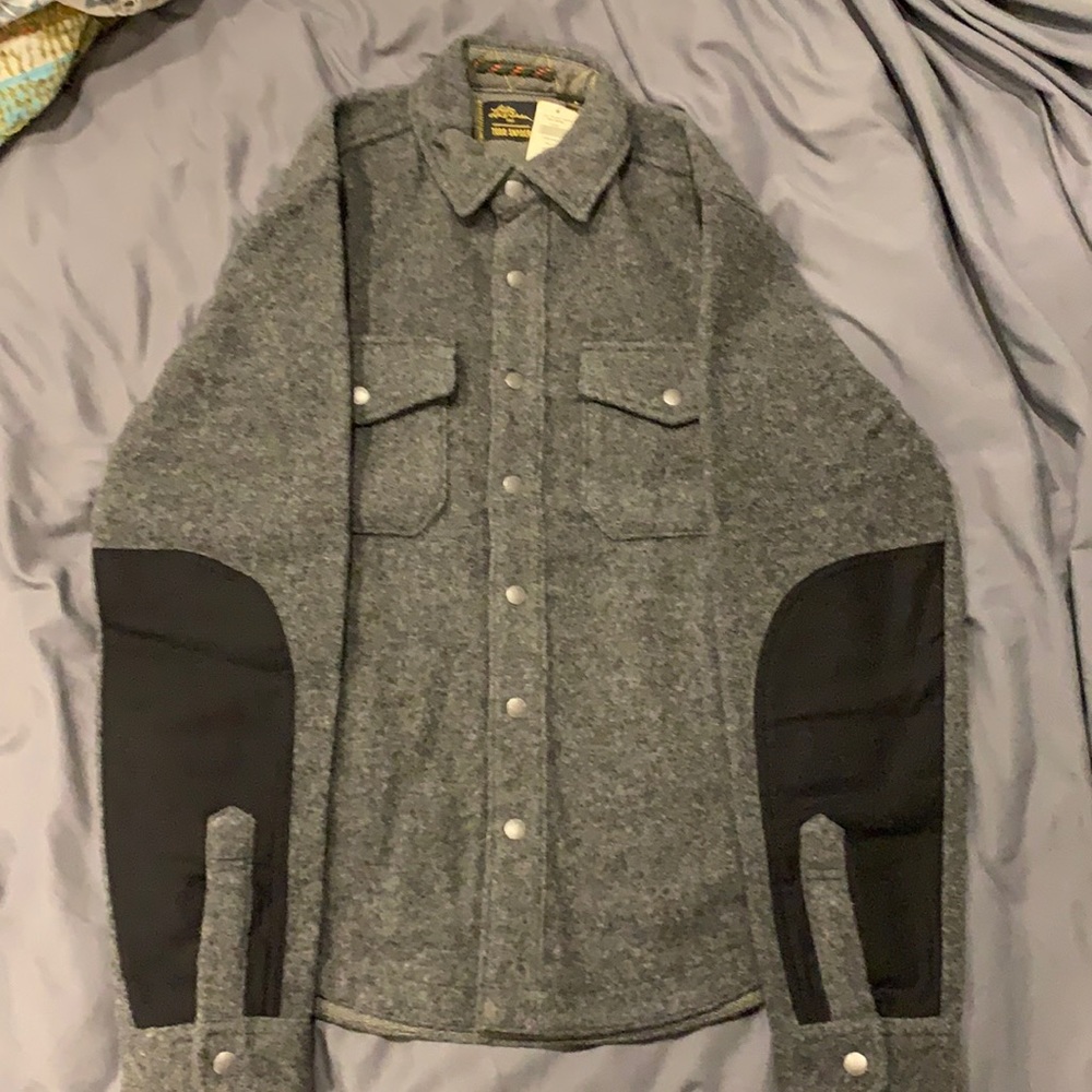 LL Bean 75%wool, 25%nylon light jacket. With 100% cotton bottom sleeves.
